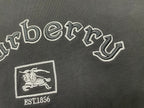 Embroidered Burberry lettering and horse crest with EST1856 on black T-shirt.