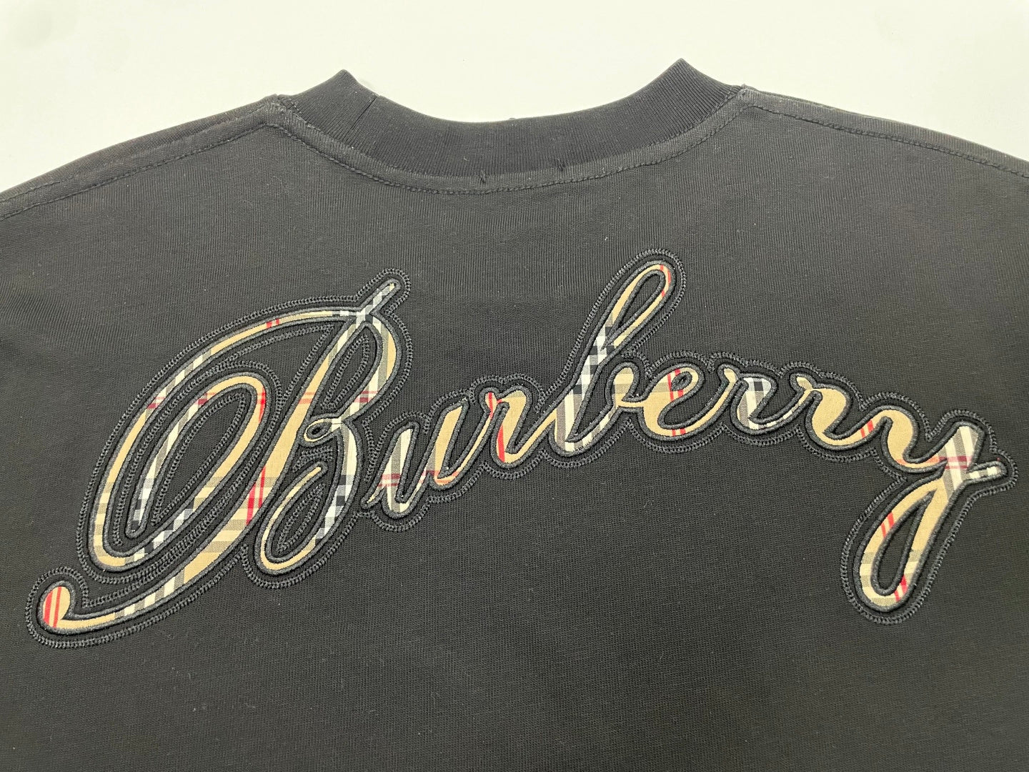 Burberry embroidered script logo on back of dark charcoal T-shirt