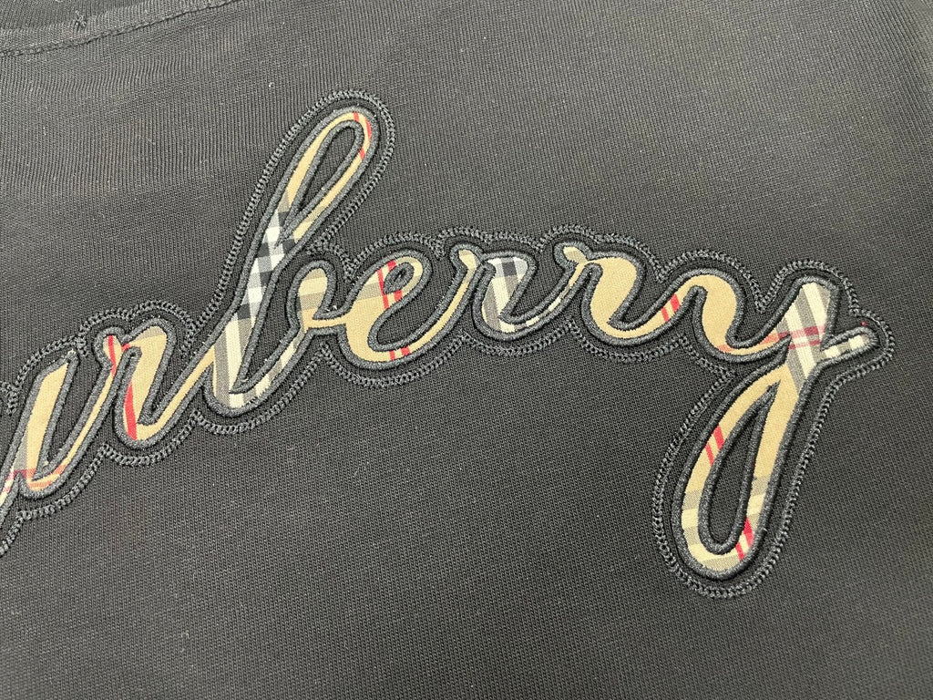 Burberry embroidered script logo on dark charcoal T-shirt fabric