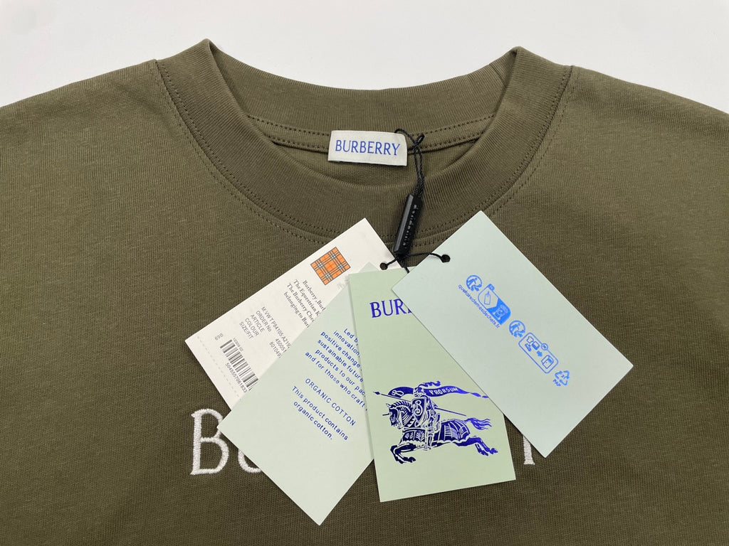 Burberry olive short-sleeve T-shirt with “BURBERRY” neck label and attached hang tags