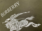 Burberry olive T-shirt with diagonal “BURBERRY” lettering and horse rider graphic