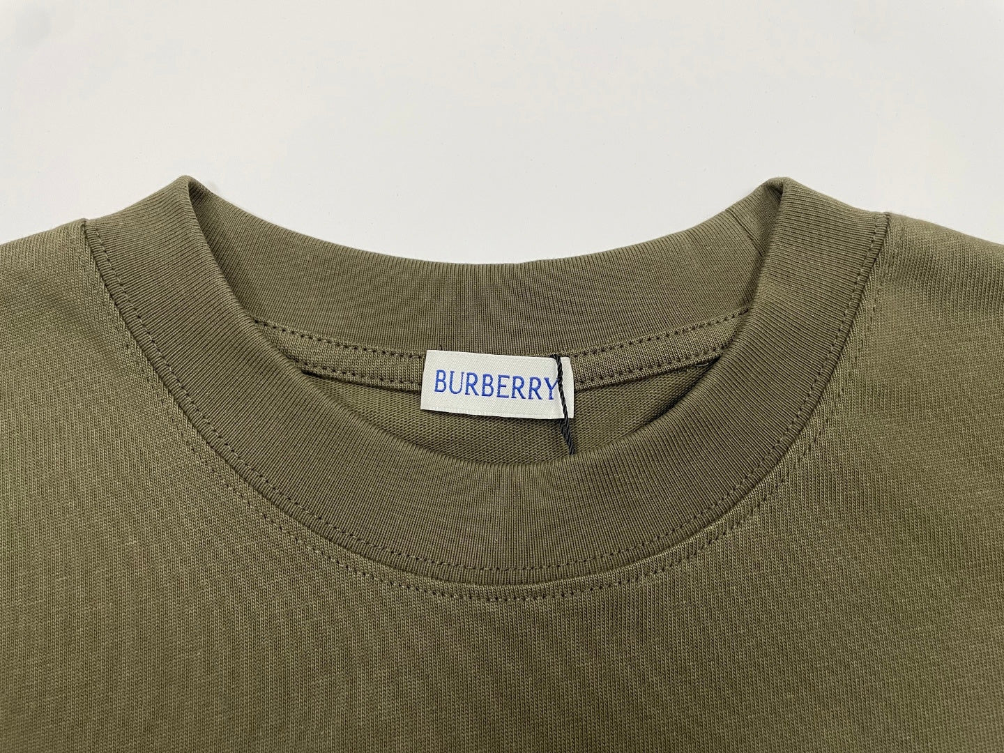 Burberry short-sleeve T-shirt neckline in olive with brand label at inner collar