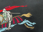 Black Burberry T-shirt close-up of mounted rider graphic and blue text