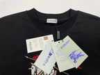 Black Burberry T-shirt with zip tag and paper labels attached near chest