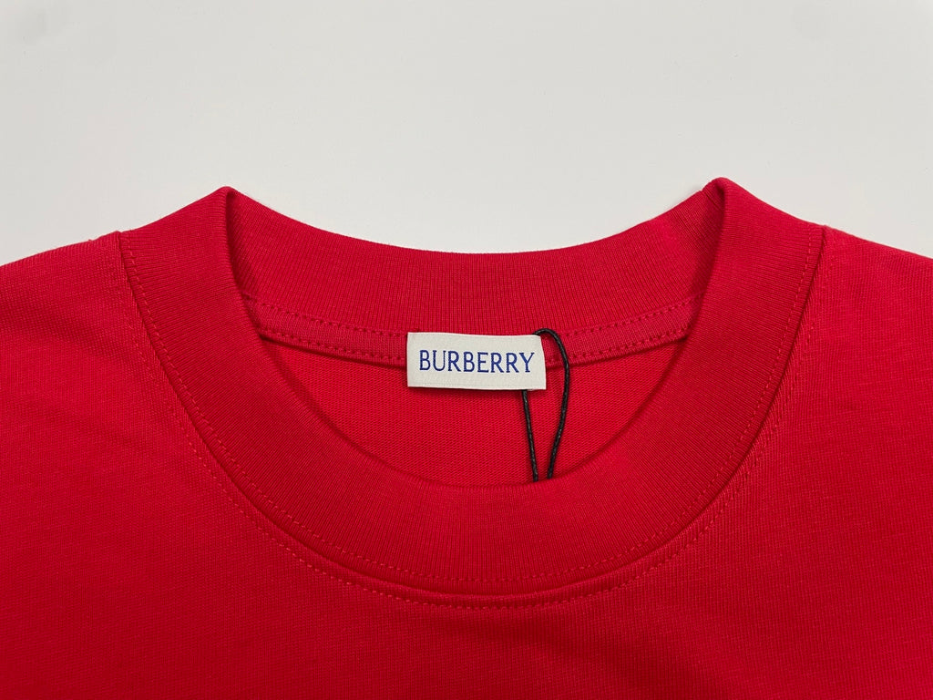 Red T-shirt neckline with white inner label and Burberry tag
