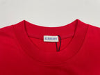 Red T-shirt neckline with white inner label and Burberry tag