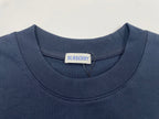 Navy crew-neck T-shirt collar with Burberry label at neckline.