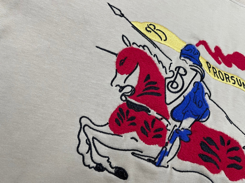 Burberry beige T-shirt close-up with red and blue rider graphic