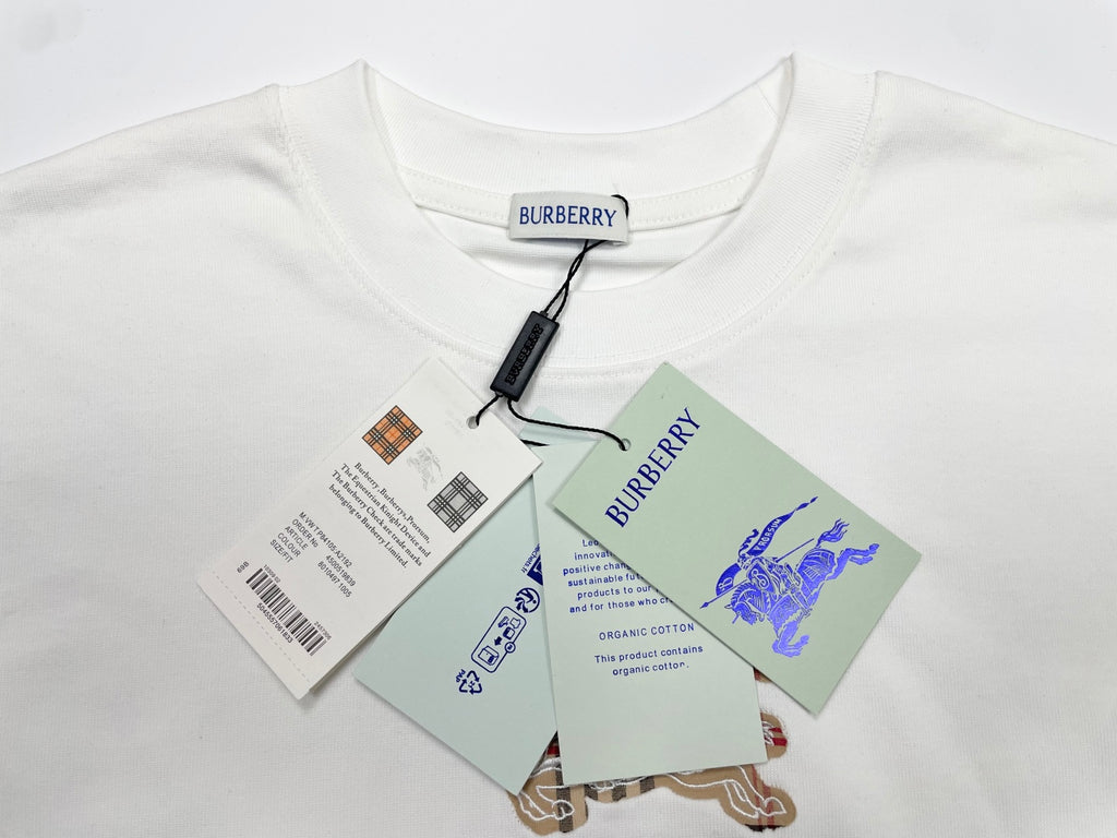 White Burberry T-shirt with hanging tags and labels at neckline