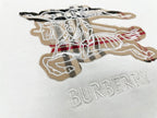 Close-up of Burberry T-shirt horse logo and BURBERRY text