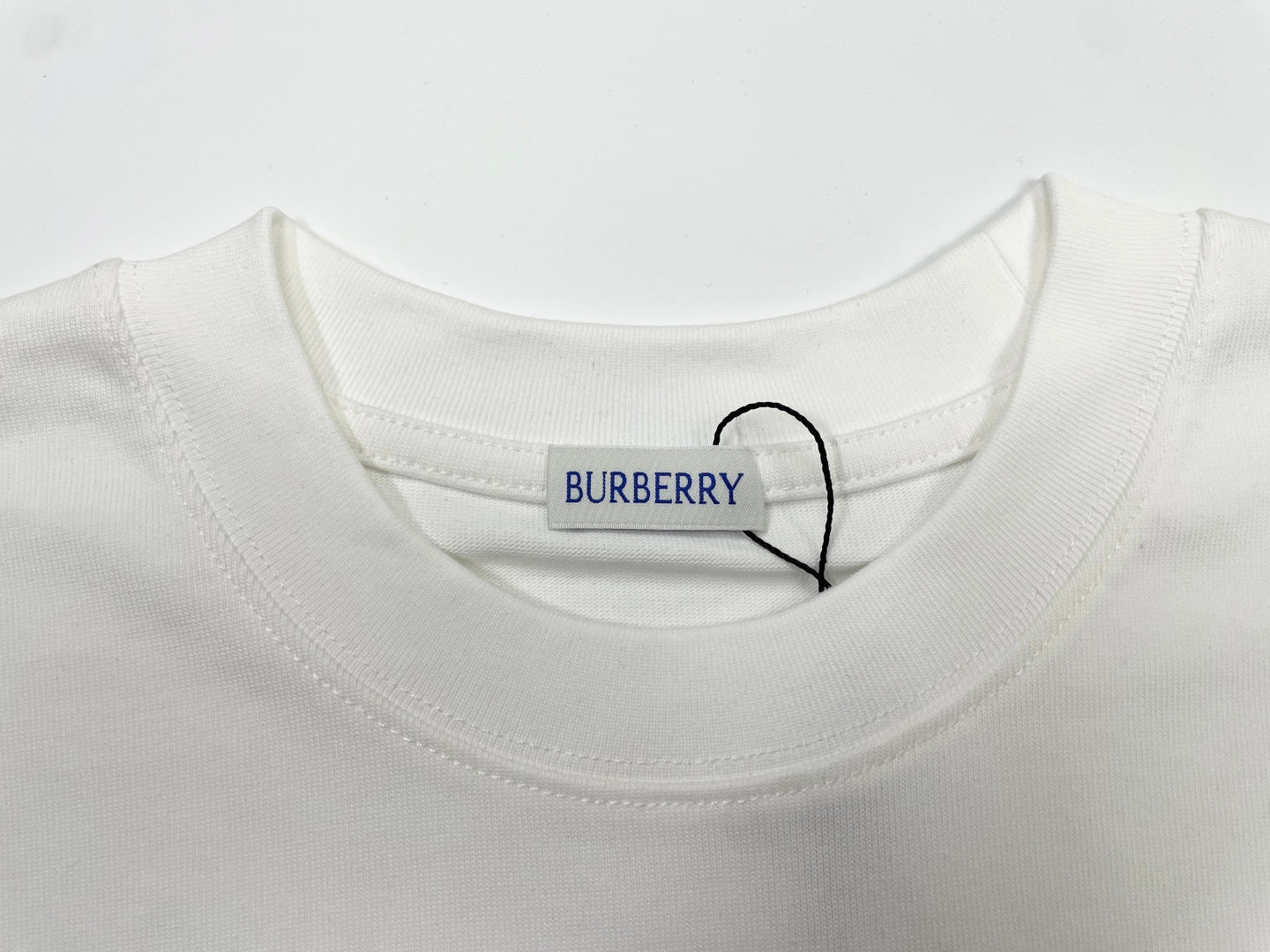 White Burberry T-shirt crew neck with BURBERRY tag at collar