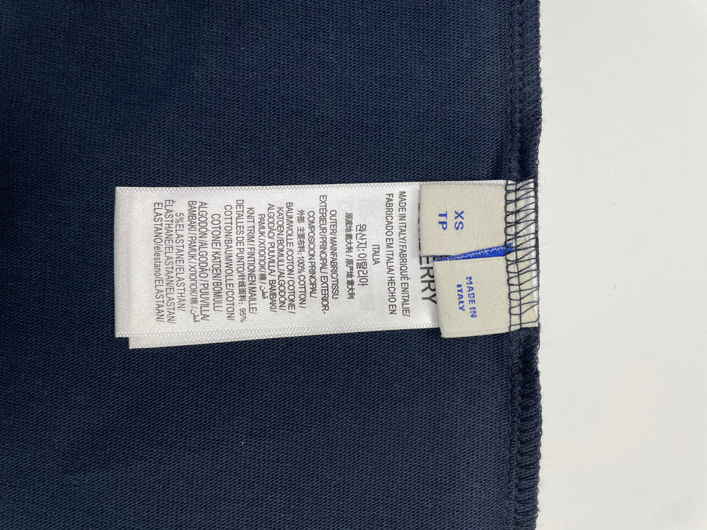 Inside neck size label marked XS on navy T-shirt