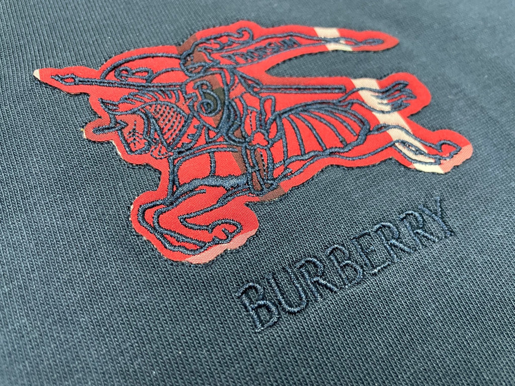 Navy T-shirt with red horse graphic and dark BURBERRY lettering