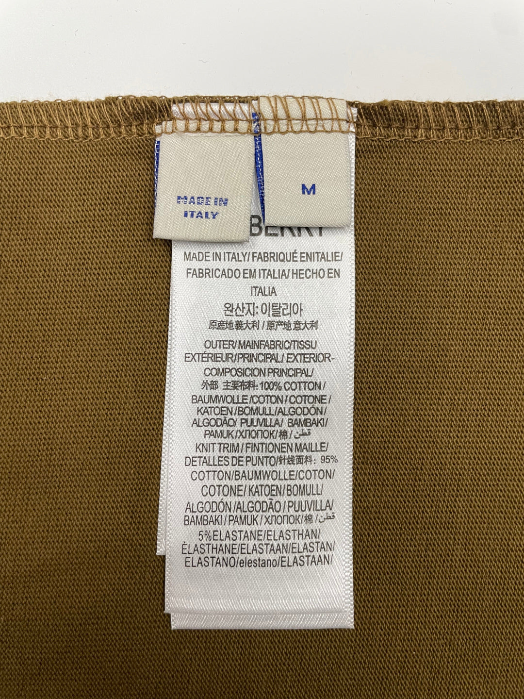 Brown T-shirt size M care label reading Made in Italy and materials