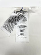 White T-shirt interior care label with washing and material instructions