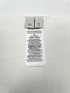 White T-shirt interior size and fabric label showing XS and Burberry