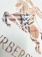 Close-up of horse graphic on white T-shirt with plaid and check pattern