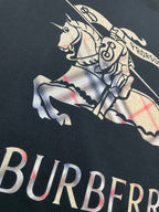 Black T-shirt close-up of horse-and-rider graphic with Burberry lettering