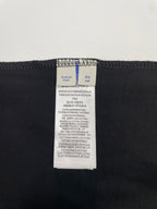 Black Burberry T-shirt fabric care label with size XS and TP