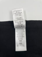 Black Burberry T-shirt care instructions label with fabric composition details