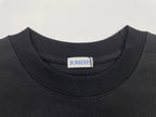 Black short-sleeve T-shirt neckline with Burberry logo tag at collar