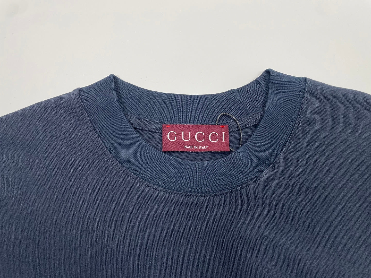 Navy crew-neck T-shirt neckline with Gucci label