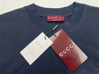Navy crew-neck T-shirt with hang tags attached