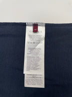 Inside view of navy T-shirt with size and care label on collar