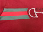 Red T-shirt chest stripe with green and white horsebit logo graphic