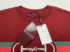 Red crewneck T-shirt with hanging tags and Gucci horsebit logo stripe