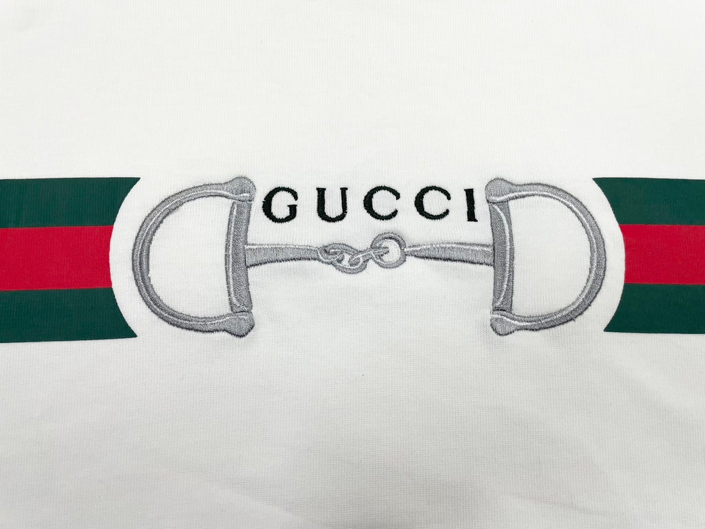 White T-shirt sleeve with green and red stripe and horsebit graphic