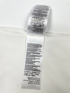 White T-shirt care label with printed instructions