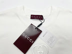 White short-sleeve T-shirt with Gucci hang tag and circular GG logo