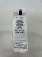 White T-shirt size and care label with Gucci branding