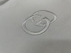 White short-sleeve T-shirt close-up of GG logo embroidery