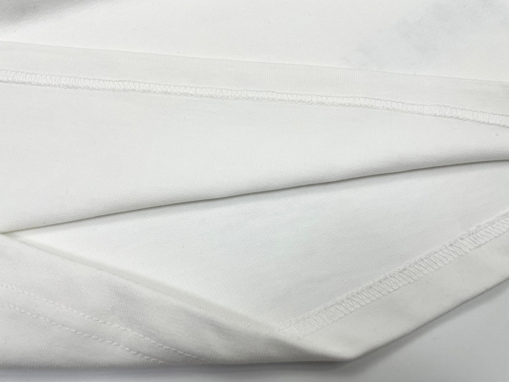 White T-shirt fabric fold with stitched hem edge