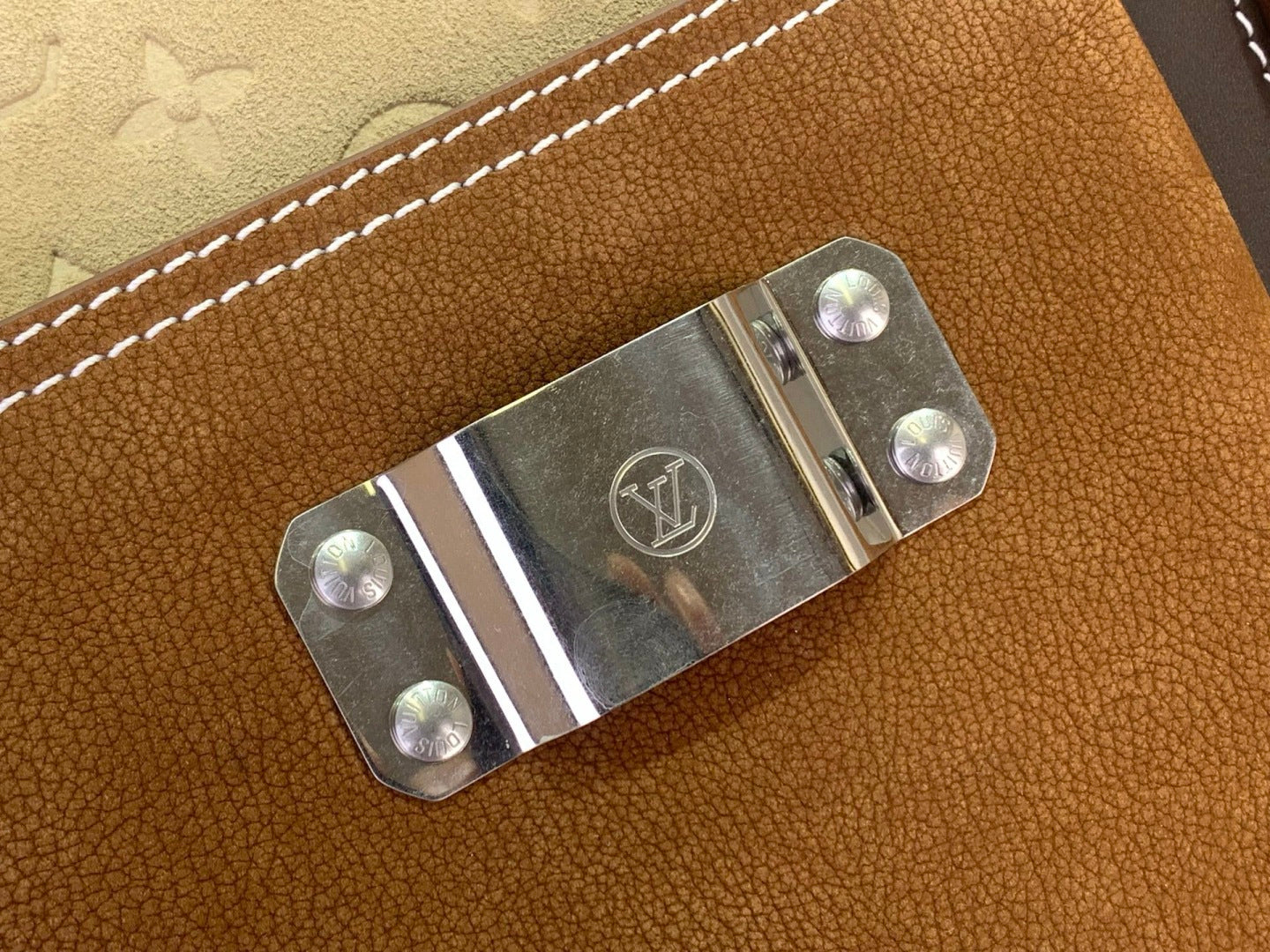 Louis Vuitton bag leather flap with metal clasp and LV logo