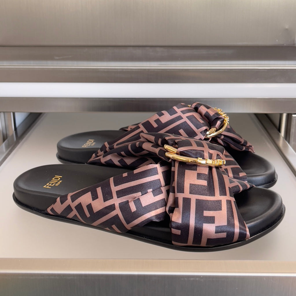 Fendi sandals with FF logo print straps, black footbed, gold buckle hardware