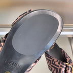 Fendi sandal outsole view with FF-pattern edge trim and gold hardware detail