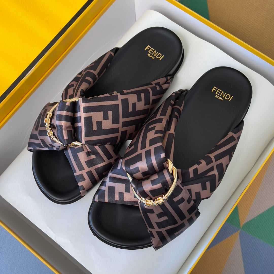 Fendi sandals with FF-pattern fabric straps, black footbeds, gold buckle ornament