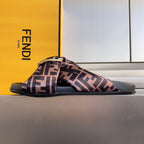 Fendi slide sandals with FF-patterned fabric straps and gold buckle detail