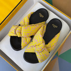 Fendi yellow patterned slide sandals with knotted bow strap and gold-tone chain buckle