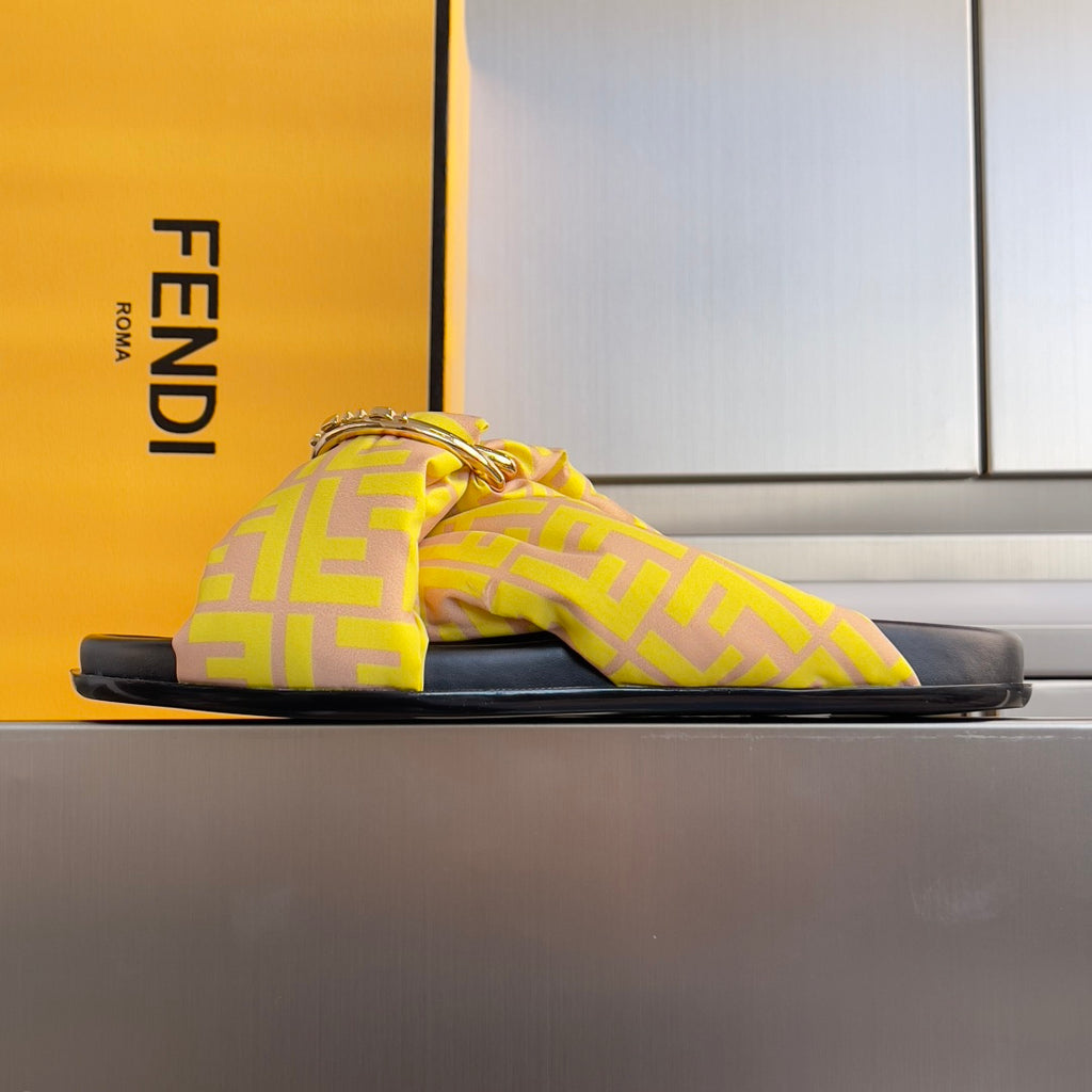 Fendi yellow patterned slide sandals with knotted strap, gold-tone chain buckle, black sole