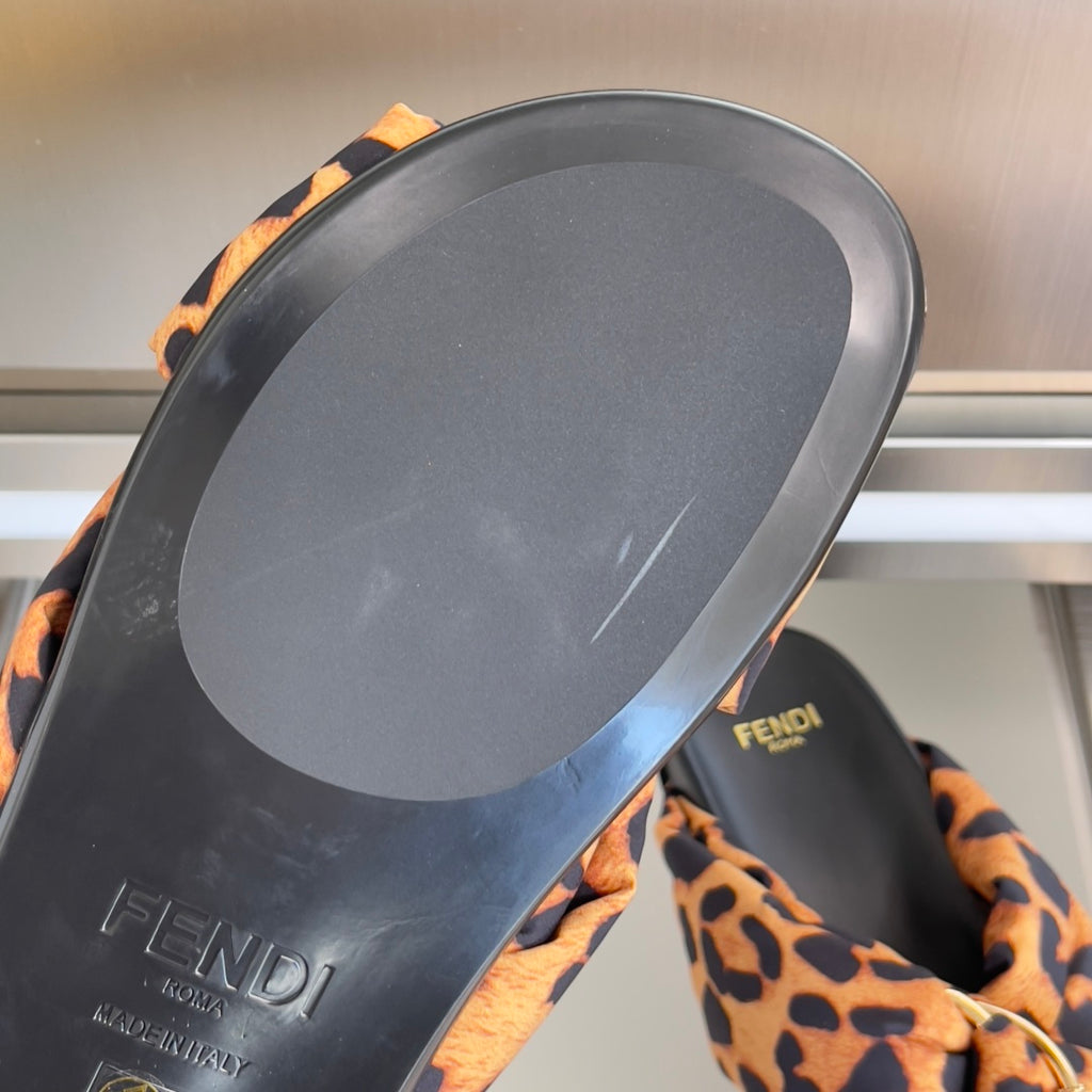 Fendi leopard-print slide sandals with black outsole and FENDI branding