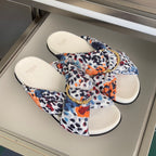 Fendi slide sandals with multicolor leopard-print fabric straps and gold-tone chain buckle detail
