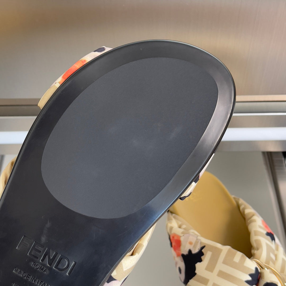 Fendi slide sandal outsole with Fendi branding and thick dark rubber base