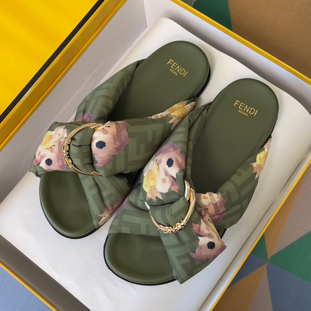 Two olive Fendi slide sandals with FF logo straps, floral bow ties and gold buckles