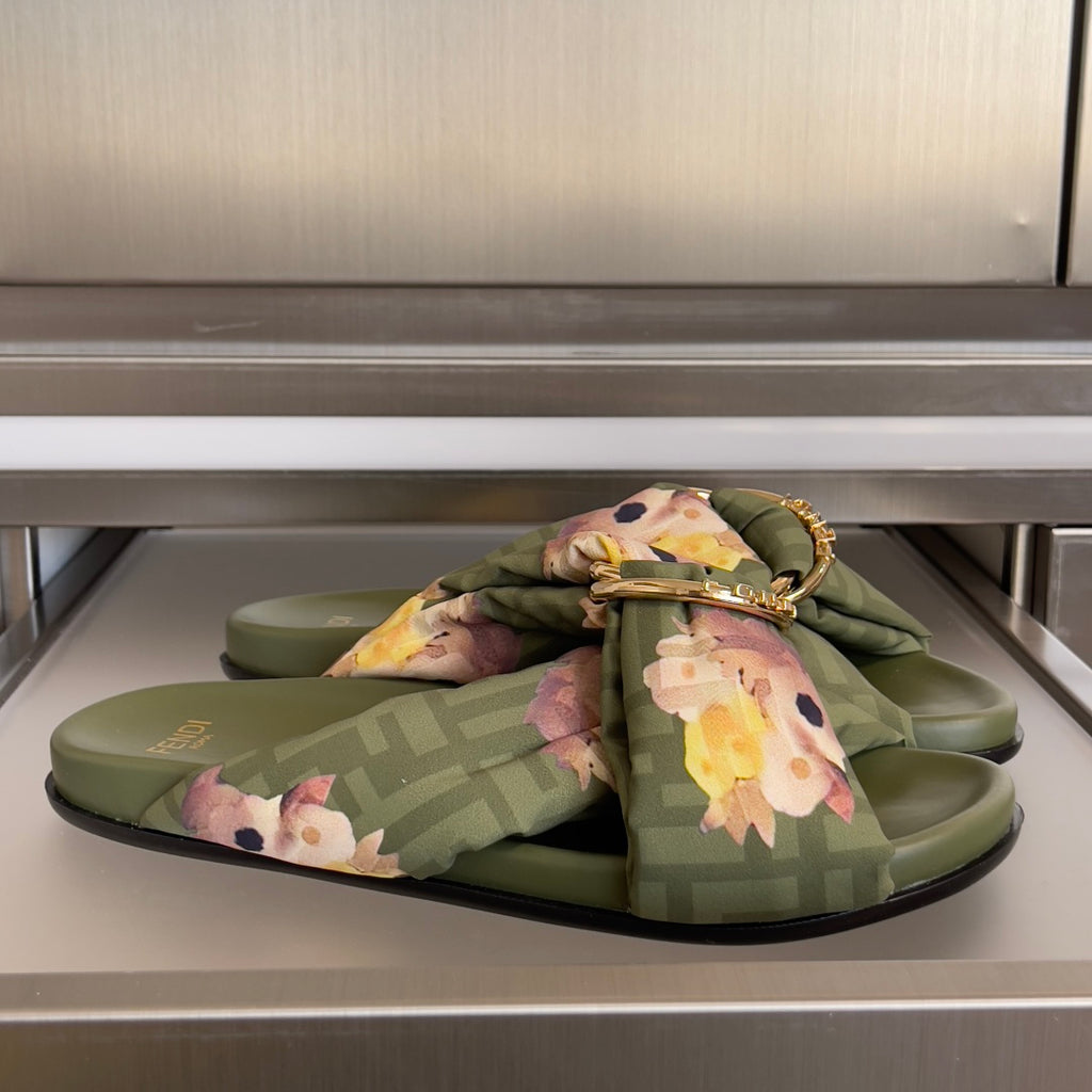 Olive Fendi slide sandals with floral bow and gold hardware over FF monogram straps