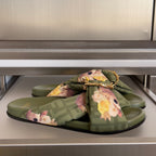 Olive Fendi slide sandals with floral bow and gold hardware over FF monogram straps
