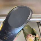 Olive Fendi slide sandal sole with FENDI logo, green upper with floral bow detail